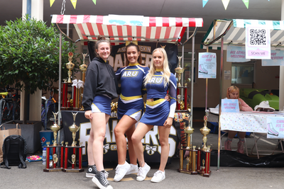 Cheerleaders posing at the Freshers' Fair