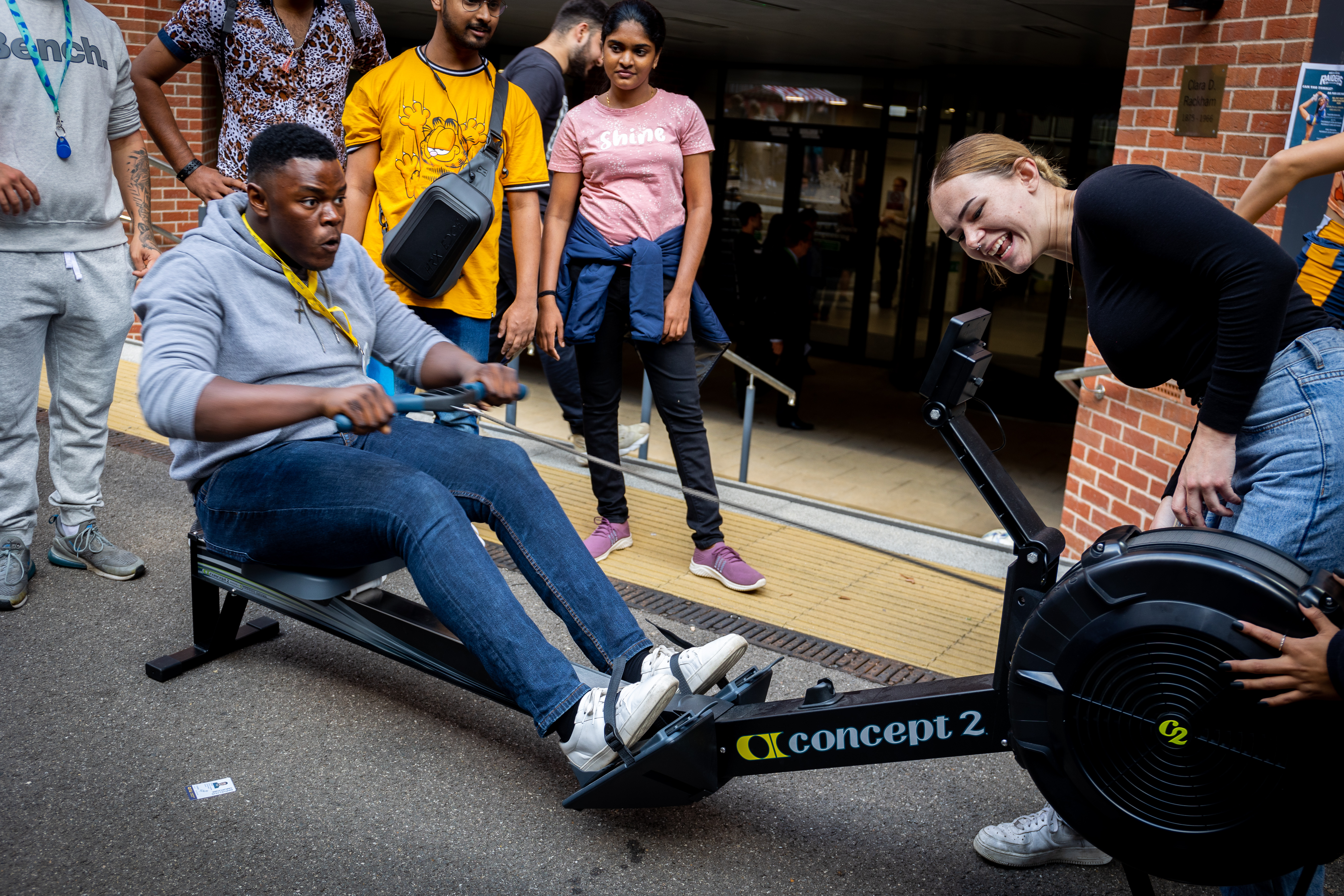 Man on rowing machine at the Welcome Fair